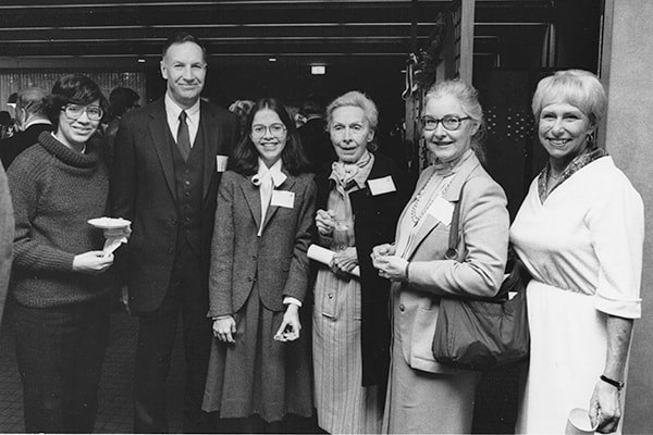 image of Susan at her graduation in 1984 with her sister, Betsy, Professor Dale Briggs, her grandmother, her mother, and Elaine Harden from the College of Engineering.