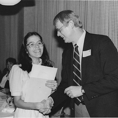 image of Susan receiving the College of Engineering's Hellwarth Award in 1985 from former College Dean and President of the University of Michigan, James Duderstadt.