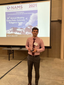 A photo of Jovan Kamcev holding his NAMS Young Membrane Scientist Award.