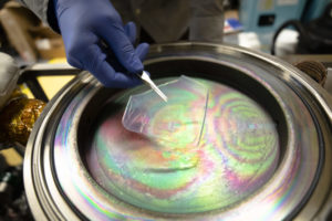 A solar-transparent aerogel is placed into a device that will apply an atom-thick coating for use in solar-thermal power plants in a lab in the G.G. Brown Laboratory on North Campus at the University of Michigan in Ann Arbor, MI on November 2, 2021.