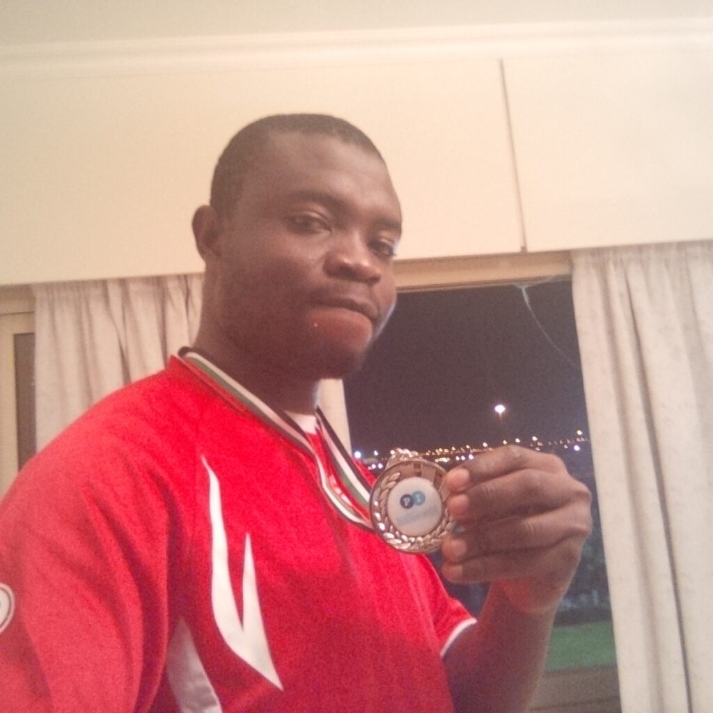Animasahun pictured with 2nd place metal for intramural soccer competition